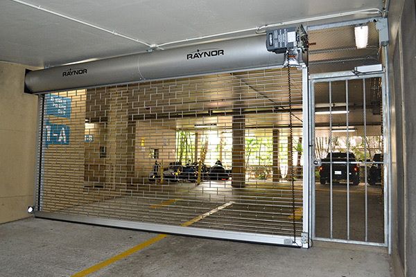 image of commercial Duragrill roll-up door with pedestrian gate by Raynor Hawaii Overhead Doors