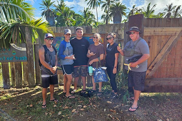 image of raynor employees helping at loko ea fish pond in 20223