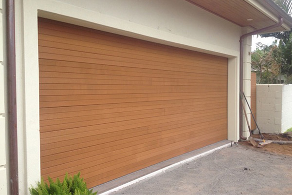 image of wooden garage door on home by Raynor Hawaii