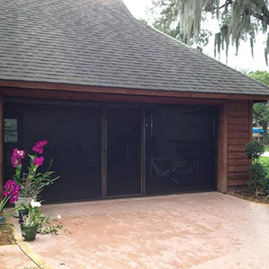 image of home with garage door screen