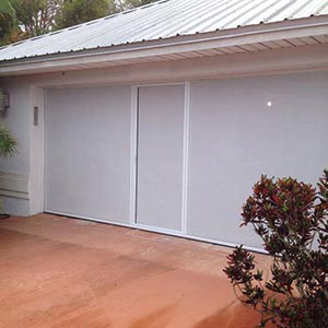 image of home with garage door screen