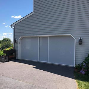 image of home with garage door screen